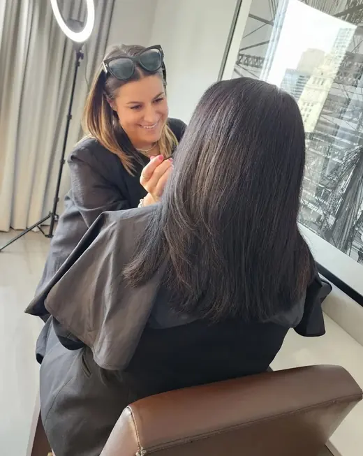 Kelly La Banco applying makeup on location